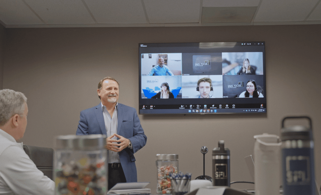 CEO Tony Horwath leading a meeting in a conference room.